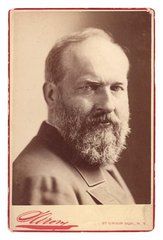 A CHOICE GARFIELD CABINET PHOTO: 4 1/8" x 6 1/2" Cabinet Photograph of JAMES GARFIELD (1831-1881) President of the United States. Thin red border. "Sarony 87 Union Sqr. N.Y." Stamp at bottom edge. Overall Fine.