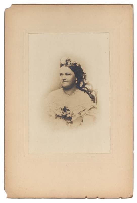 Brady Photo Of Mary Todd Lincoln: [MARY TODD LINCOLN]. Photograph. 6" x 9". Sepia print mounted to original stock. Taken by Matthew Brady in Washington in 1862. Some slight edge chipping and minor loss of corners at upper and lower le