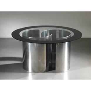 Luigi Caccia Dominioni (Milano, 1913 - 2016) TABLE: METAL STRUCTURE, GLASS TOP TAVOLO MODELLO FASCIA SPECCHIATA struttura in metallo, ripiano in vetro Produzione Azucena, Italia, 1970 circa alt. cm 73 e diam. cm 132 Bibliografia di confronto M. Imparat