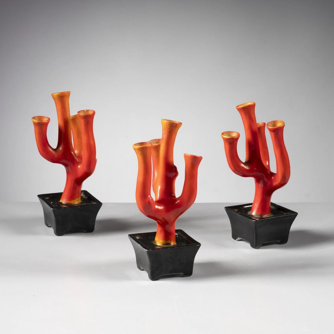 Gio Ponti: Gio Ponti (Milano, 1891 - 1979) THREE CORAL VASES, BLACK AND ORANGE PORCELAIN TRE CORALLI PORTAFIORI in porcellana nei toni del nero e dell’arancio Produzione Richard-Ginori,