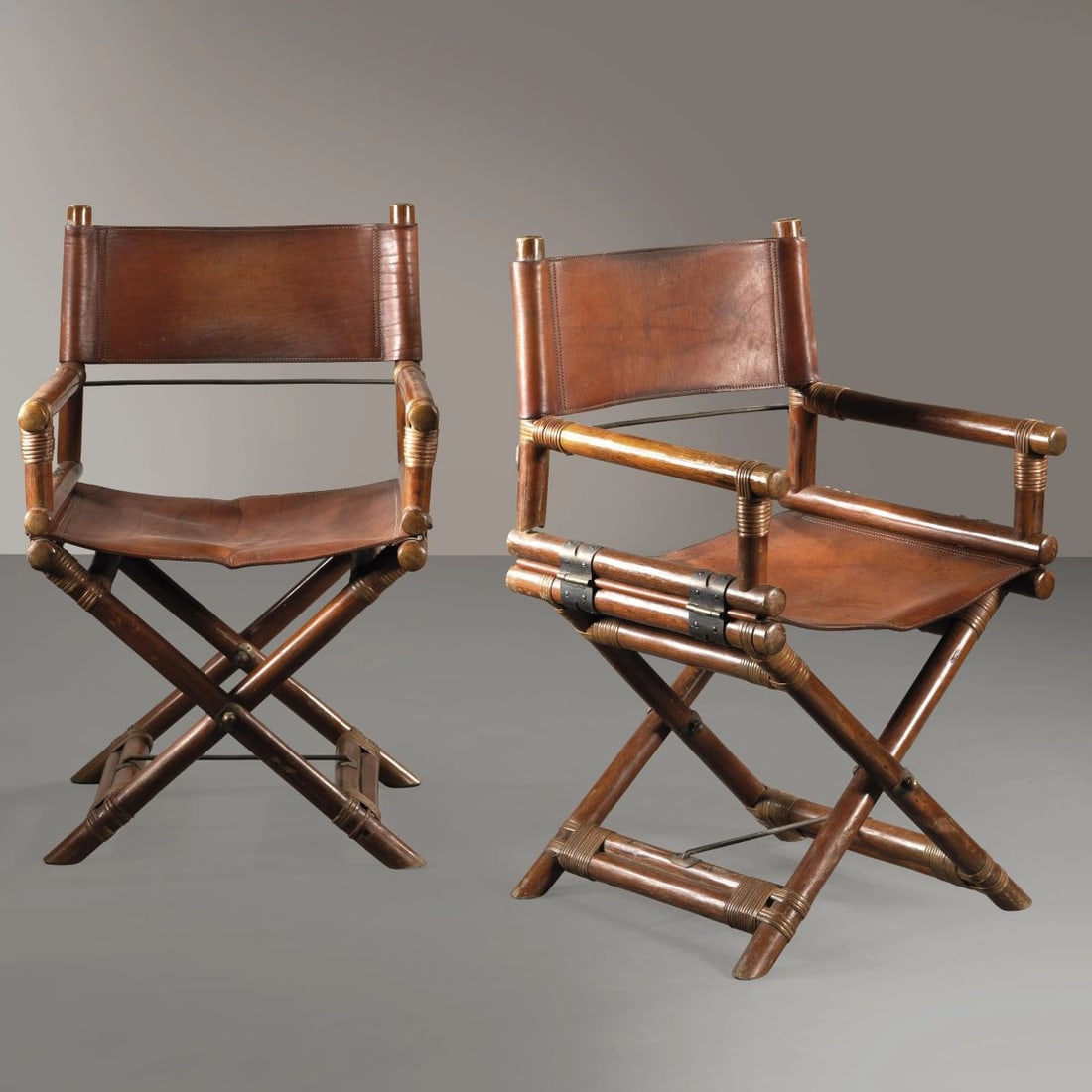 McGuire: McGuire A PAIR OF ARMCHAIRS COPPIA DI POLTRONCINE in legno e cuoio Produzione McGuire, Inghilterra, 1970 circa cm H93xL58xP57 Bibliografia di confronto Domus 450, 05/1967, p. d/382