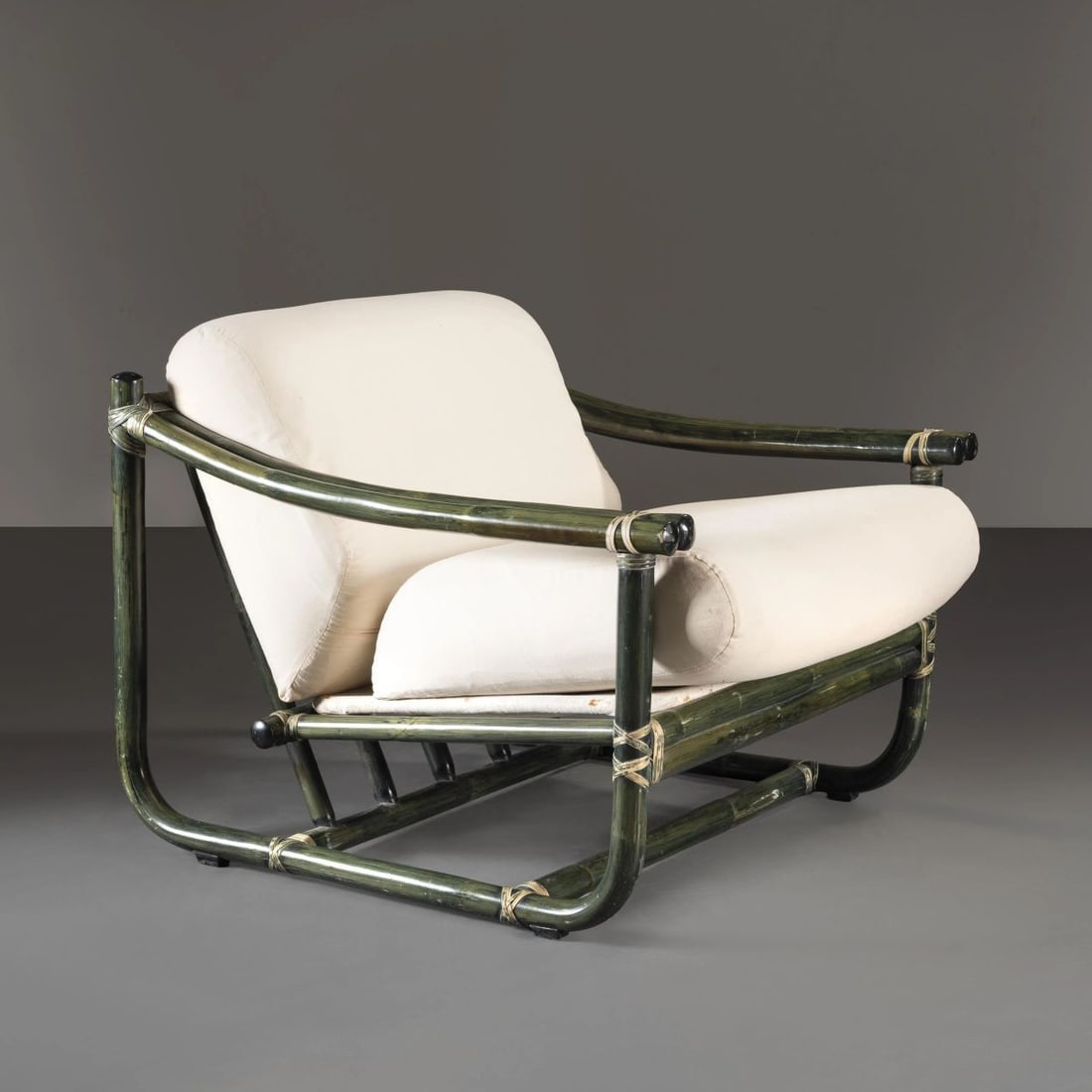 Tito Agnoli: Tito Agnoli (Lima, 1931 - Milano, 2012) P.1/1 ARMCHAIR POLTRONA MODELLO P.1/1 in bambù, cuscini imbottiti e rivestiti in tessuto nei toni del bianco Produzione Bonacina, Italia, 1960