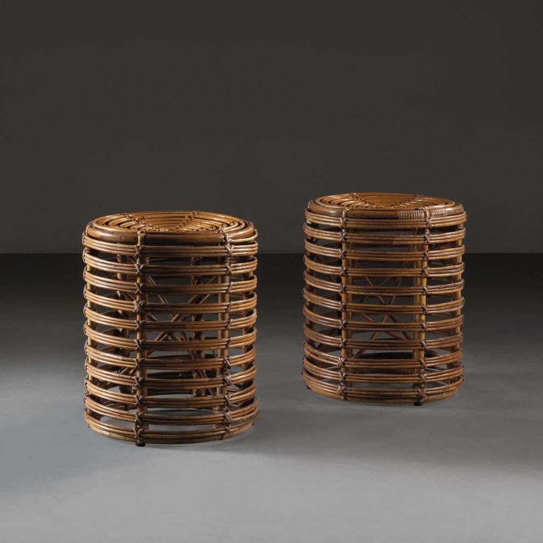 A COUPLE OF STOOLS: A COUPLE OF STOOLS COPPIA DI SGABELLI in midollino Produzione Italia, 1960 circa alt. cm 42 e diam. cm 36