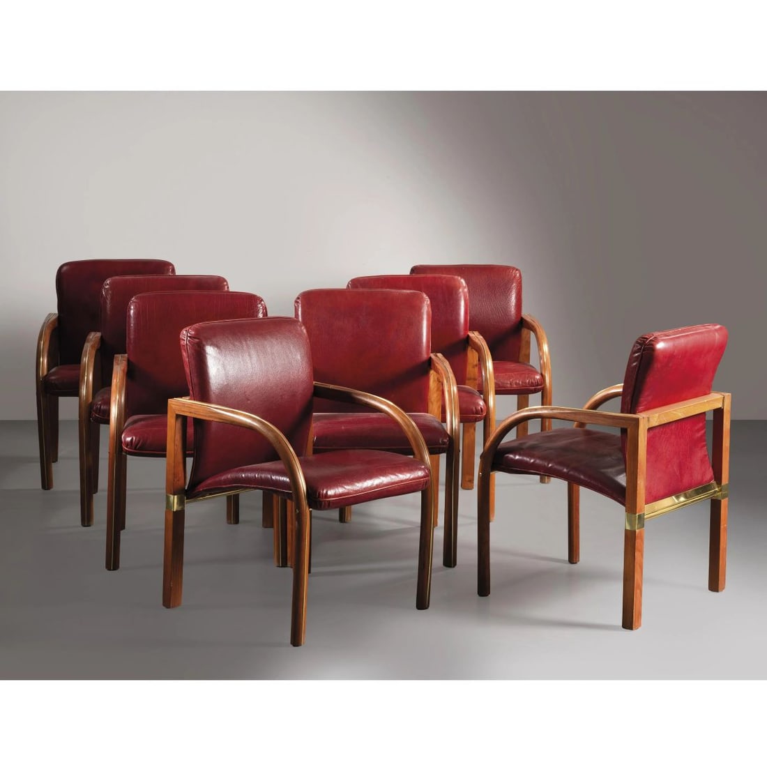 EIGHT ARMCHAIRS: EIGHT ARMCHAIRS, WOODEN STRUCTURE, RED LEATHER UPHOLSTERED OTTO POLTRONE struttura in legno, rivestite in pelle nei toni del bordeaux, dettagli in metallo Produzione Italia, 1980 circa cm H88xL59xP59