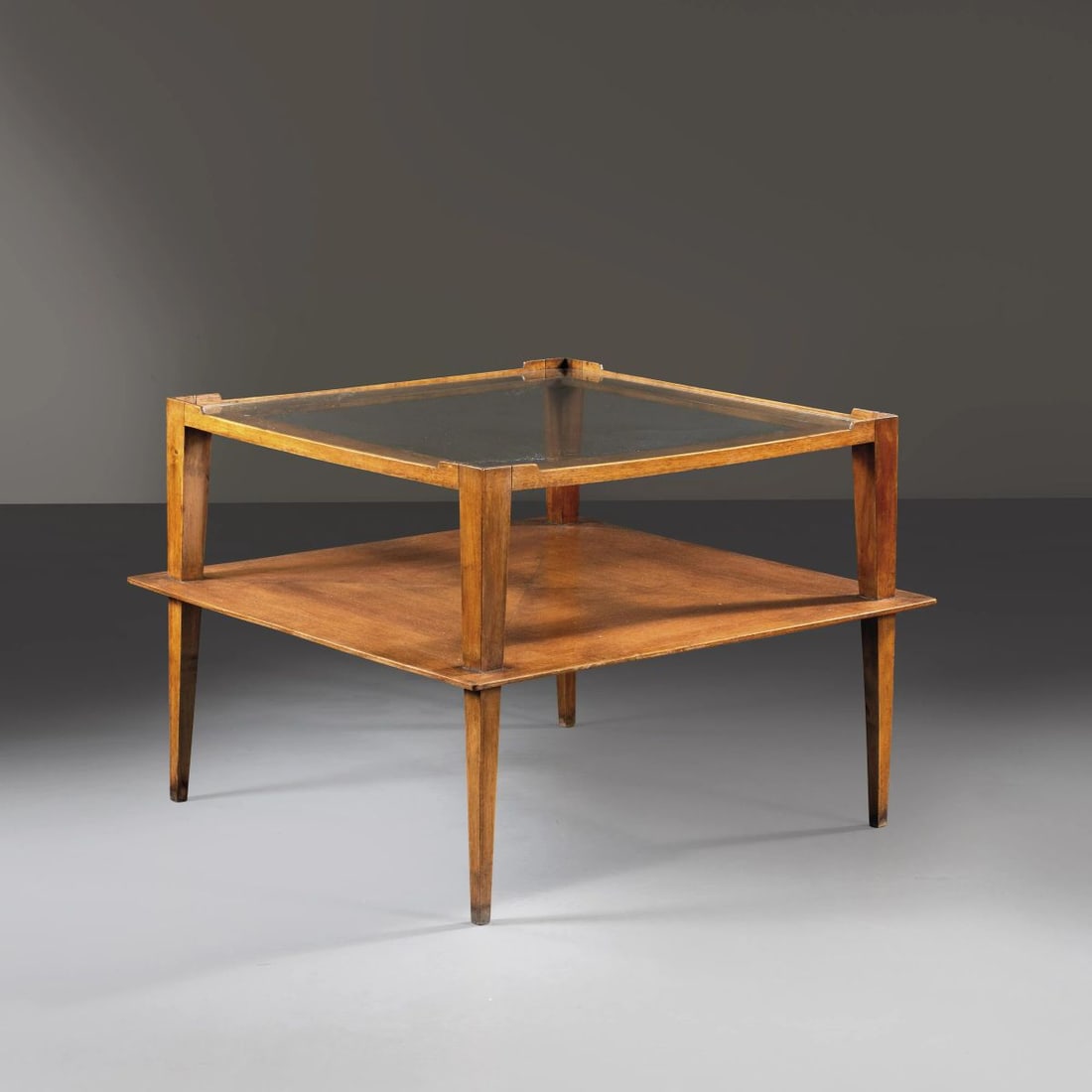 Gio Ponti: Gio Ponti (Milano, 1891 – 1979) WOODEN TABLE, GLASS TOP TAVOLO DA CENTRO in legno, ripiano in vetro Produzione Italia, 1950 circa cm H54xL75xP75 Il lotto è accompagnato da un certi