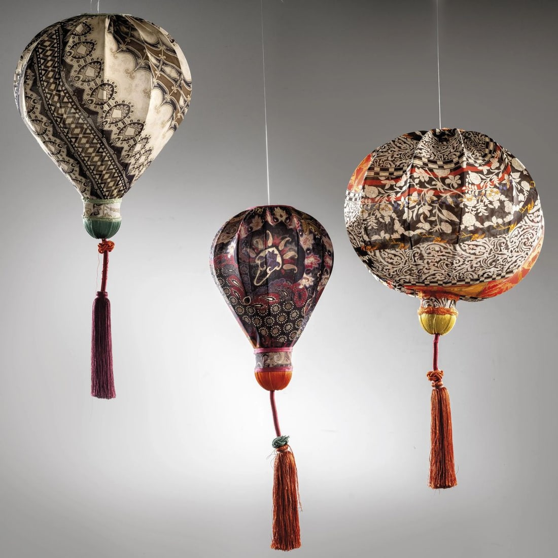 Etro: Etro THREE LANTERNS TRE LANTERNE struttura in metallo, rivestite in tessuto Produzione Etro, Italia, 2000 circa alt. 40 cm e diam. cm 38 alt. cm 43 e diam. cm 30 alt. cm 36 e diam.