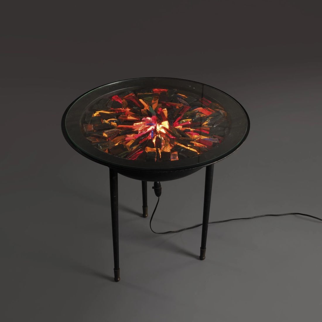 LIGHTED LOW TABLE, METAL STRUCTURE, GLASS TOP: LIGHTED LOW TABLE, METAL STRUCTURE, GLASS TOP TAVOLO BASSO LUMINOSO in metallo, ripiano in vetro Produzione Francia 1955 circa alt. cm 47 e diam. cm 51