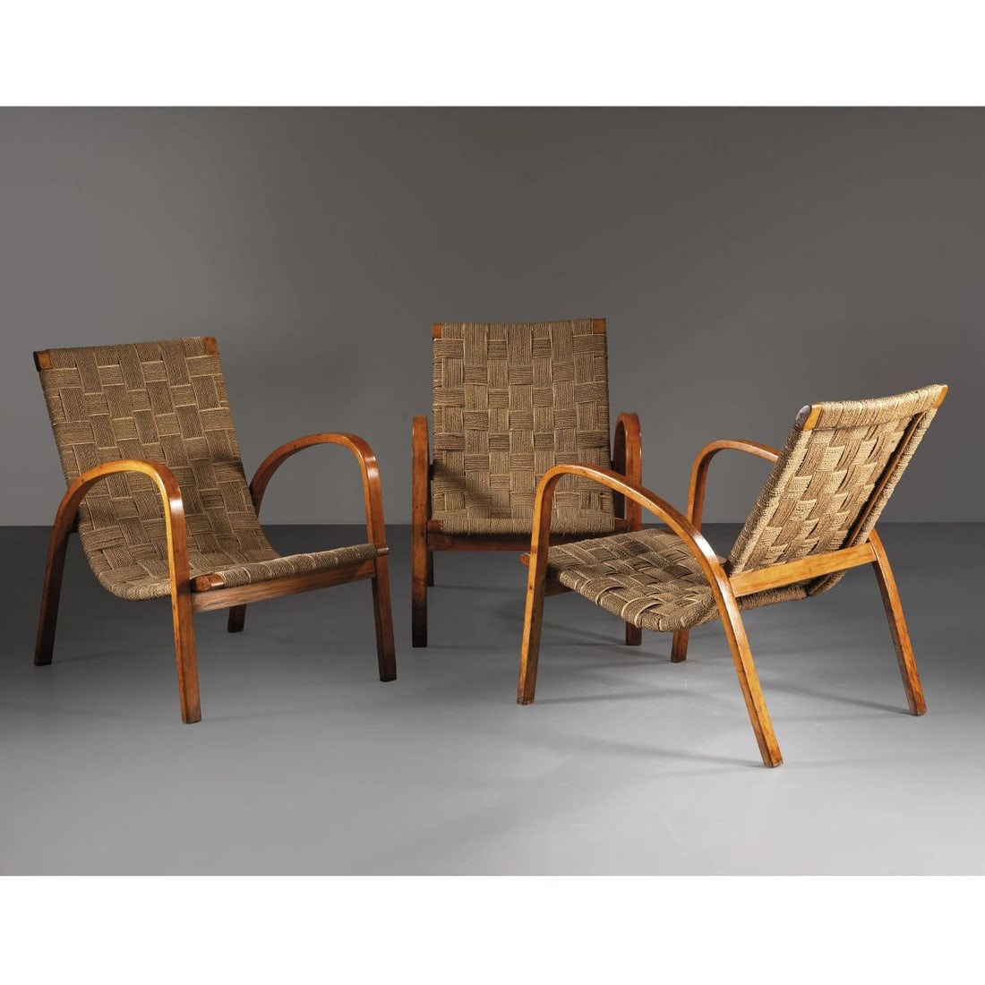 THREE ARMCHAIRS: THREE ARMCHAIRS, WOODEN STRUCTURE, ROPE SEAT TRE POLTRONE struttura in legno, seduta in corda Produzione Italia, 1930 circa cm H88xL60xP75