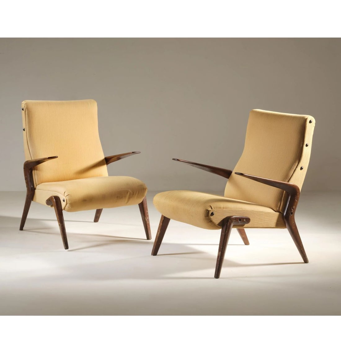 Osvaldo Borsani: Osvaldo Borsani (Varedo, 1911 - Milano, 1985) A COUPLE OF «P71» ARMCHAIRS, WOODEN STRUCTURE, YELLOW FABRIC UPHOLSTERY COPPIA DI POLTRONE MODELLO P71 struttura in legno, imbottite e 