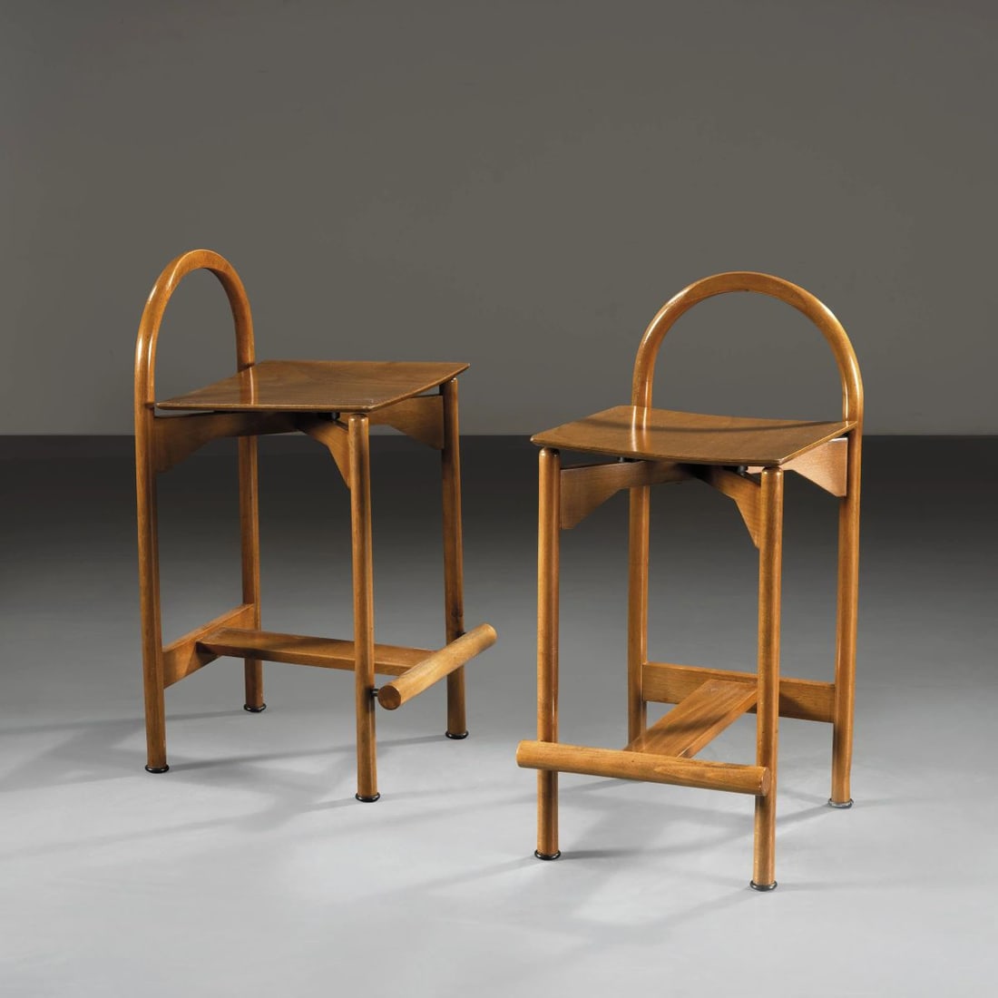 Gigi e Pepe Tanzi: Gigi e Pepe Tanzi TWO WOODEN STOOLS DUE SGABELLI MODELLO TABU’ in legno Produzione Pozzi & Verga, Italia, 1978 cm H79xL38xP44,5 Bibliografia di confronto G. Gramigna, Repertorio 1950-1980, Mondadori
