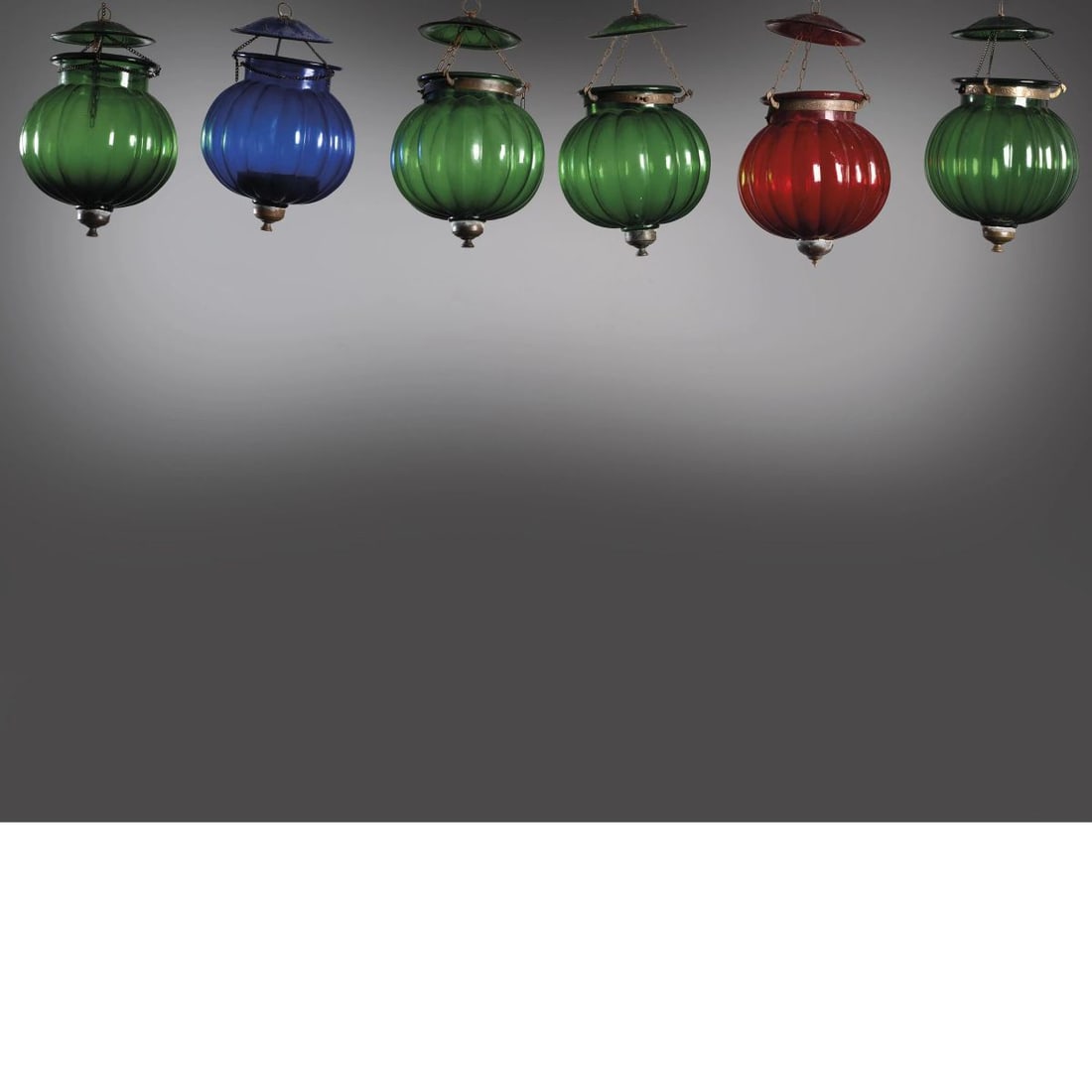 SIX GREEN, BLUE AND ORANGE GLASS LANTERNS: SIX GREEN, BLUE AND ORANGE GLASS LANTERNS SEI LANTERNE in vetro nei toni del verde, blu e rosso Produzione Italia, 1970 circa cm H40xL25xP25