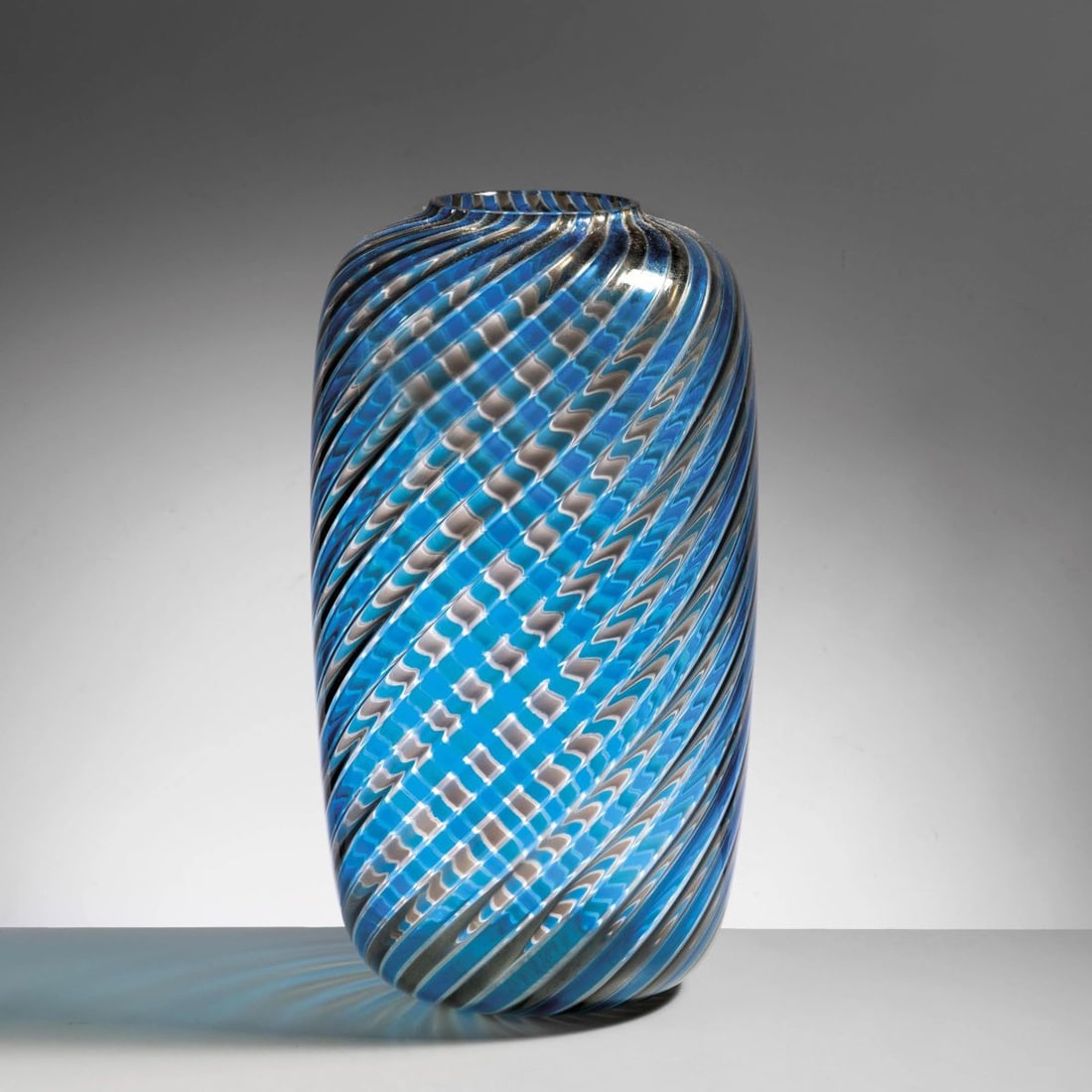 Venini: Venini A CANNE SERIES BLUE AND GRAY GLASS VASE VASO DELLA SERIE A CANNE in vetro nei toni del blu e del grigio Produzione Venini, 1980 circa marcato e datato a punta sul fondo alt. cm 35 e diam. cm 19