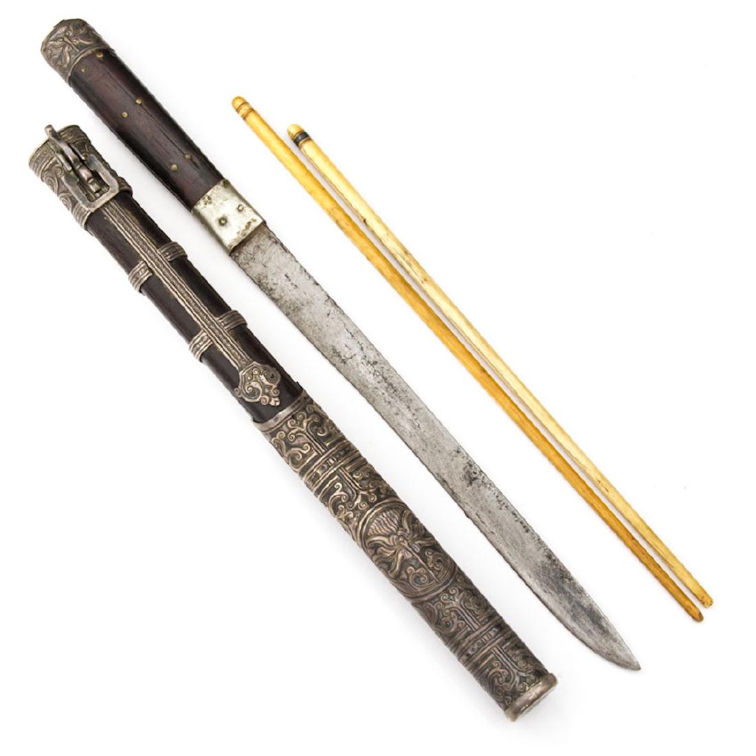 TROUSSE SET, MONGOLIA, 19TH C.: Heavy embossed silver mounted case and knife hilt with a pair of chopsticks. length 15 1/2 in.