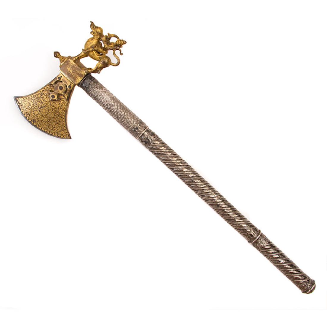 GILT AXE, SOUTH INDIA, 18TH C.: An outstanding and rare piece. A large bronze? sculpture of lord Shiva is mounted on a yali (South Indian mythical beast) gilded, attached to a steel axe head which is profusely decorated with dense f