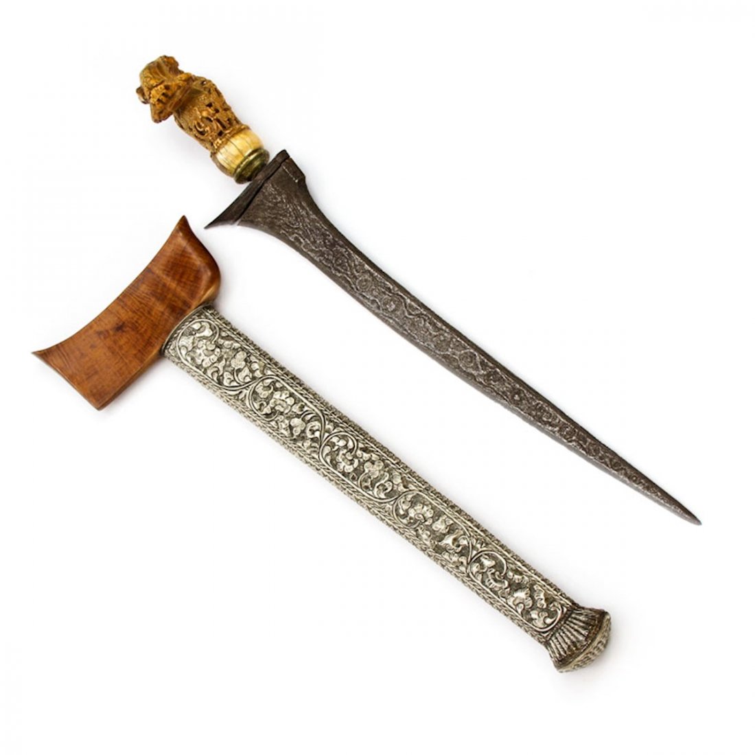 KRIS DAGGER, MADURA, 19TH C.: An impressive piece with good blade and strong pommel, the hilt is a large bent-over carved in flower style, the pendok is nicely embossed silver. * Please review Terms & Conditions, including spec