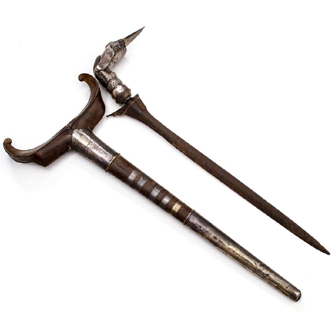 KRIS DAGGER, PATANI NORTH MALAYSIA: The blade and sheath are of Sumatran style, the hilt an excellent Hulu Wayang (Kingfisher hilt) rendering in silver. Publications: Frey, Edward. "The Kris: Mystic weapon of the Malay world." New Yo