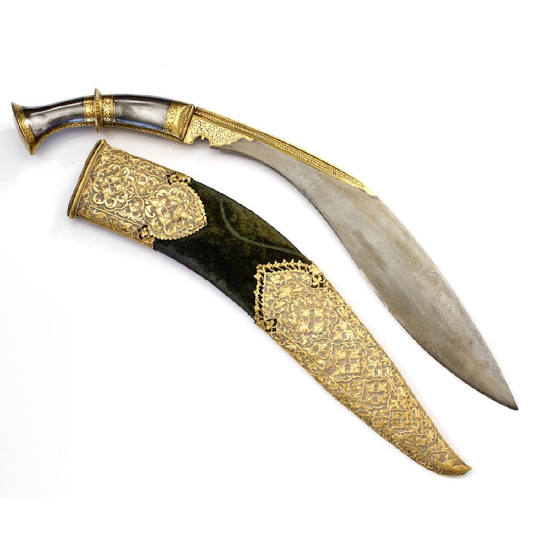 KUKRI KNIFE, NEPAL: Exceptional kurki knife with scabbard with large gold chapes over green velvet, hilt and blade rib are in heavy gold designs. length 20 7/8 in.