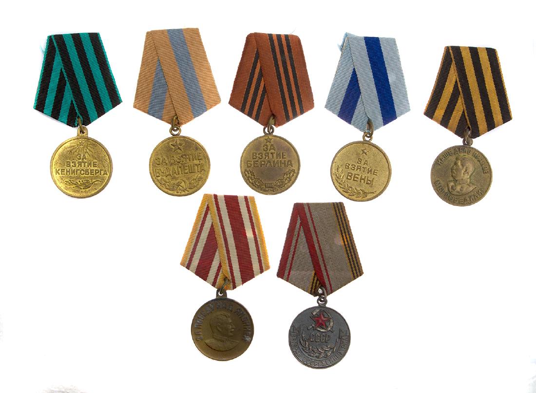 GROUP OF SEVEN SOVIET RUSSIAN MEDALS: 1) Medal for the Capture of Budapest; 2) Medal for the Capture of Koenigsberg; 3) Medal for the Capture of Vienna; 4) Medal for the Capture of Berlin; 5) Medal for Victory Over Germany; 6) Medal for V