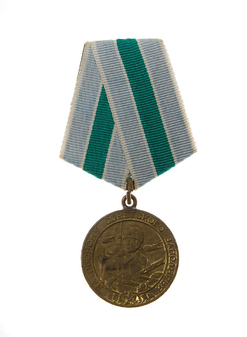 DEFENCE OF THE SOVIET POLAR REGIONS SOVIET MEDAL: Medal for the Defense of Soviet Polar Region, circa 1940s-early 50s, comes with original suspension device in brass, and replaced ribbon, original medal, in brass, shows some wear, the original gilt f