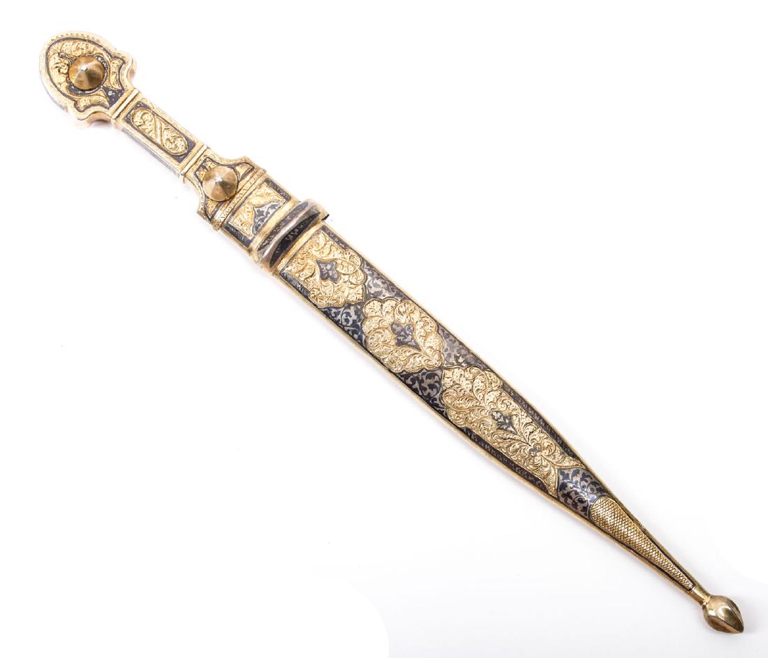 RUSSIAN OR SOVIET KUBACHI SILVER MOUNTED DAGGER, 20TH: Caucasian dagger in gilded silver mounts decorated with engraving and niello. Well polished doubled edged pointy blade with two grooves on the front and one on the back. The hilt, rivets and scabbard 