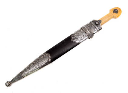 CAUCASIAN (GEORGIAN) DAGGER KAMA WITH SILVER MOUNTS: Nice Caucasian dagger with wide double edged pointy blade of Damascus steel with thick fuller on each side. The characteristic hilt curved of walrus and decorated with two silver rivets with niello fi