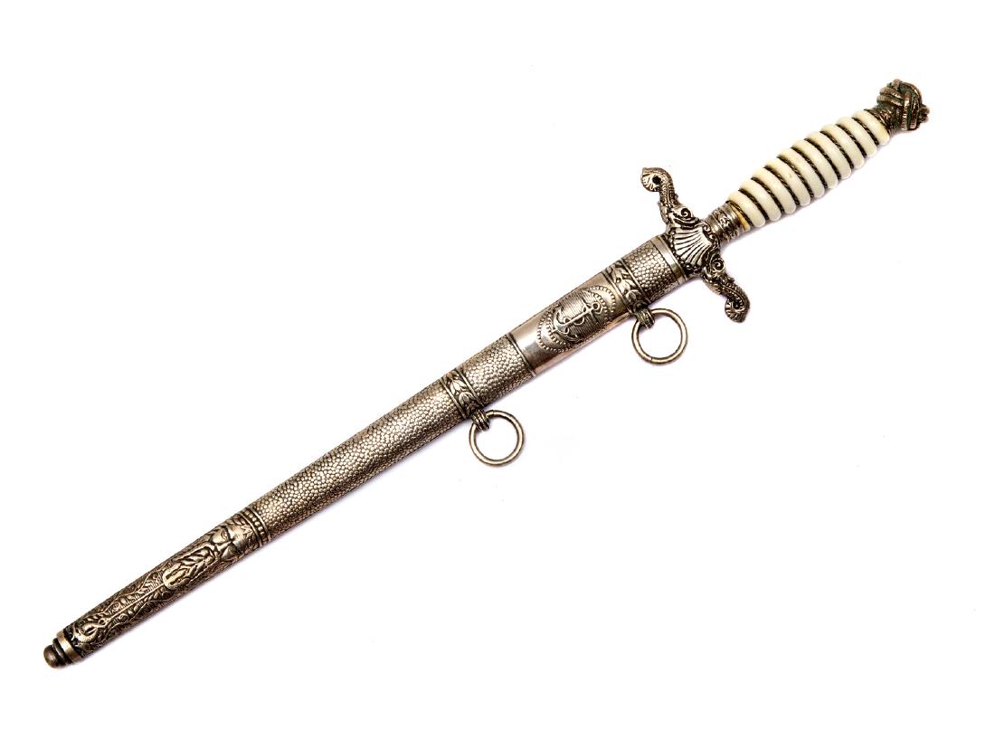 HUNGARIAN OFFICER AND NCO DAGGER OF THE ROYAL RIVER: Fine etched blade with floral designs and gilded Hungarian coat of arms and an anchor on both sides, inscription on the blade "Varadi Karoly kapitany urnal 1928". Marked on the ricasso by with Hungari