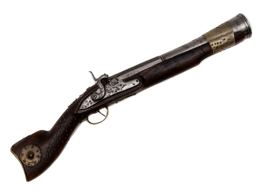 MIDDLE EASTERN BLUNDERBUSS, 19TH CEN.: 19th century Middle Eastern flintlock musket with hexagonal smooth bore barrel decorated with silver inlay. Wooden stock richly decorated with mother of pearl inlay and brass wire. Flintlock is also d