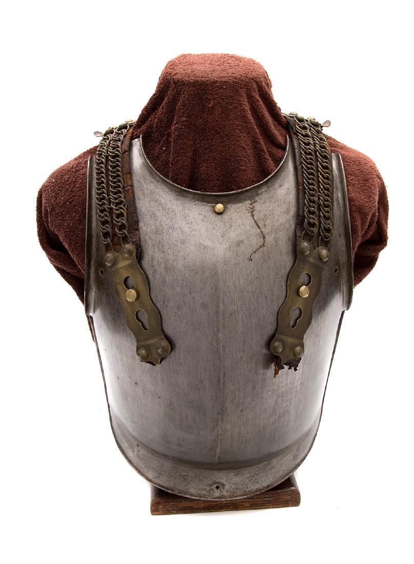 CUIRASSIER HELMET & CUIRASS, M 1872 MODIFIED 1874,: Helmet is entirely made of steel with brass fittings made by A. GODILLOT. Visor lined with brass trim. Underneath visor and lobster tail are lined with brown waxed leather. Gild chinstrap is composed 