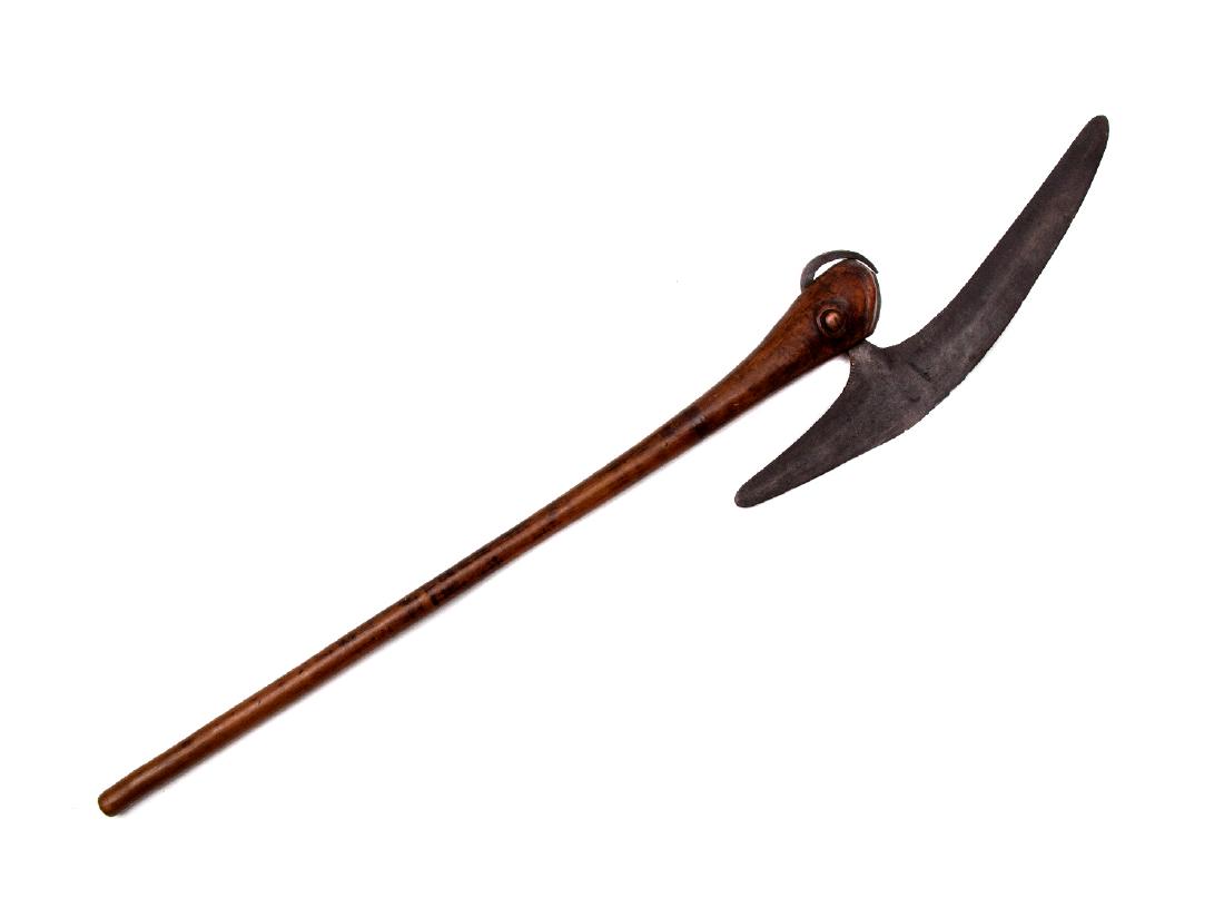 19TH CENTURY AFRICAN AXE, COLLECTION OF EDWARD FREY: A fine African axe likely from the Tsonga or Venda regions of Southern Africa. The shaft is carved as birdâ€™s head and well preserved. The blade is well forged and quite large with good chopping