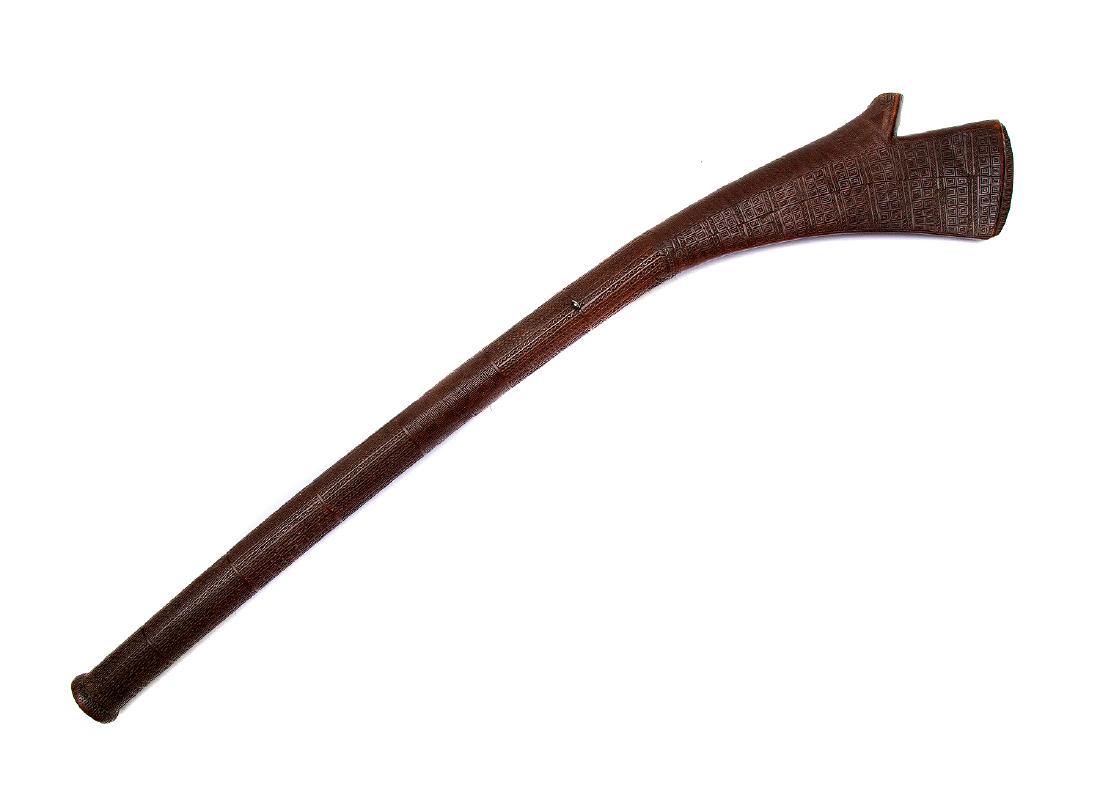 SUPERB 19TH C. FIJIAN SALI/CALI TRIBAL WAR CLUB: A carved, decorative Sali Fijian war club. This fine example has a curved, flat head with a spur, and is carved with a geometric pattern containing parallel sections of jagged lines, and some with not