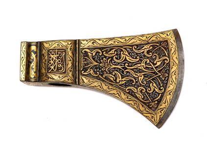 BEAUTIFUL TABARZIN HEAD WITH GILT ARABIC SCRIPTIONS: Beautiful Persian tabarzin head (saddle axe) with chiseled and etched richly gilded floral design and Arabic inscriptions. Dimensions: Length: 5 in. (12 1/2 cm.)