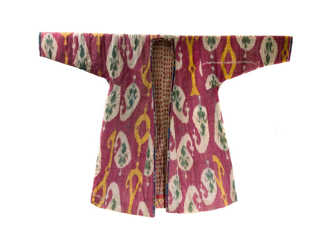 BUKHARA RED SILK AND COTTON ISHTUP COAT, 19TH C.: Beautiful Central Asian silk cotton lined ishtup ikat coat with traditional Bukhara design. The ikat is of the old design of Bukhara silk velvet ikat called â€œAlo Bakhmal.â€ Ca.: late 19th cen