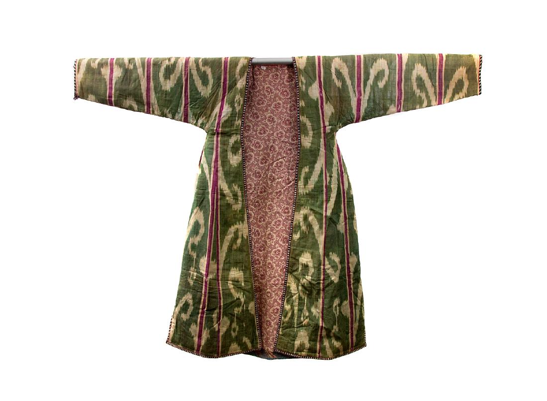 BUKHARA GREEN SILK AND COTTON ISHTUP COAT, 19TH C.: Beautiful Central Asian silk cotton lined ishtup ikat coat. Origina: Uzbekistan, Samarkand or Fergana valley, second half 19th century. Dimensions: