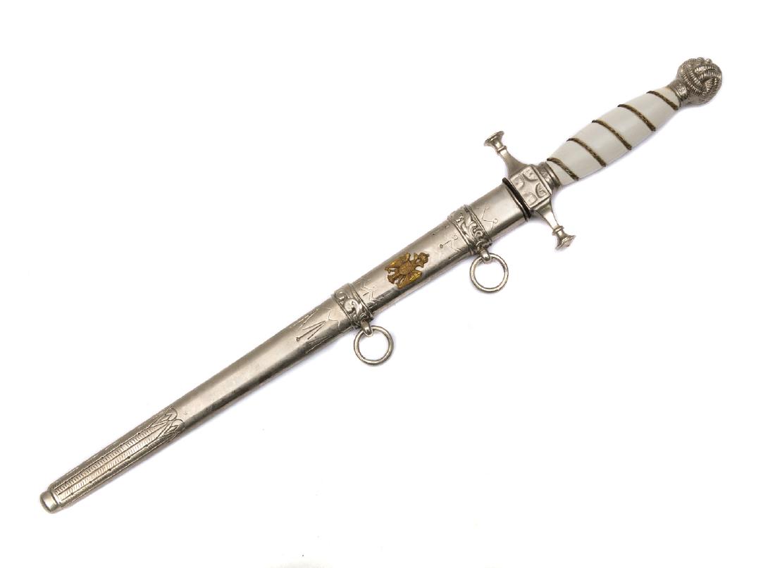 YUGOSLAVIAN GOVERNMENT OFFICIALS AND POLICE OFFICER: White celluloid grip is wrapped with spiral grove wound with twisted wire, knot style metal pommel, all metal parts and scabbard are made of while metal, nickel plated double edged blade with diamond 