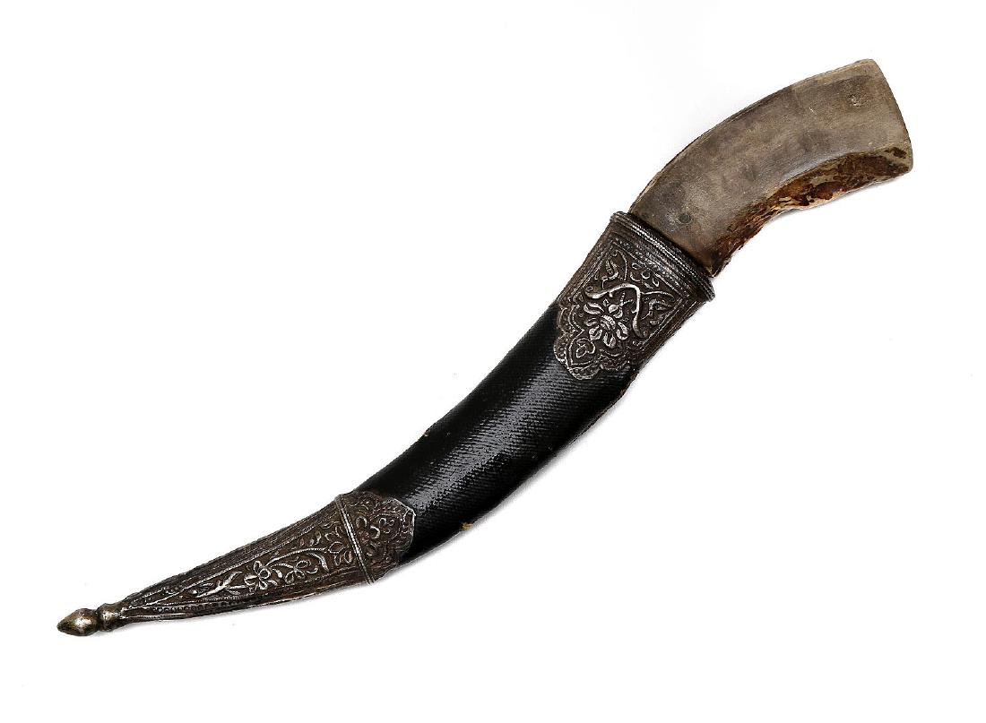 WOOTZ STEEL PERSIAN KHANJAR DAGGER: Persian khanjar with watered steel blade decorated with etched animas at forte. Original black leather scabbard with hammered silver mounts. Original hilt has been replaced with deer horn, 19th cen.