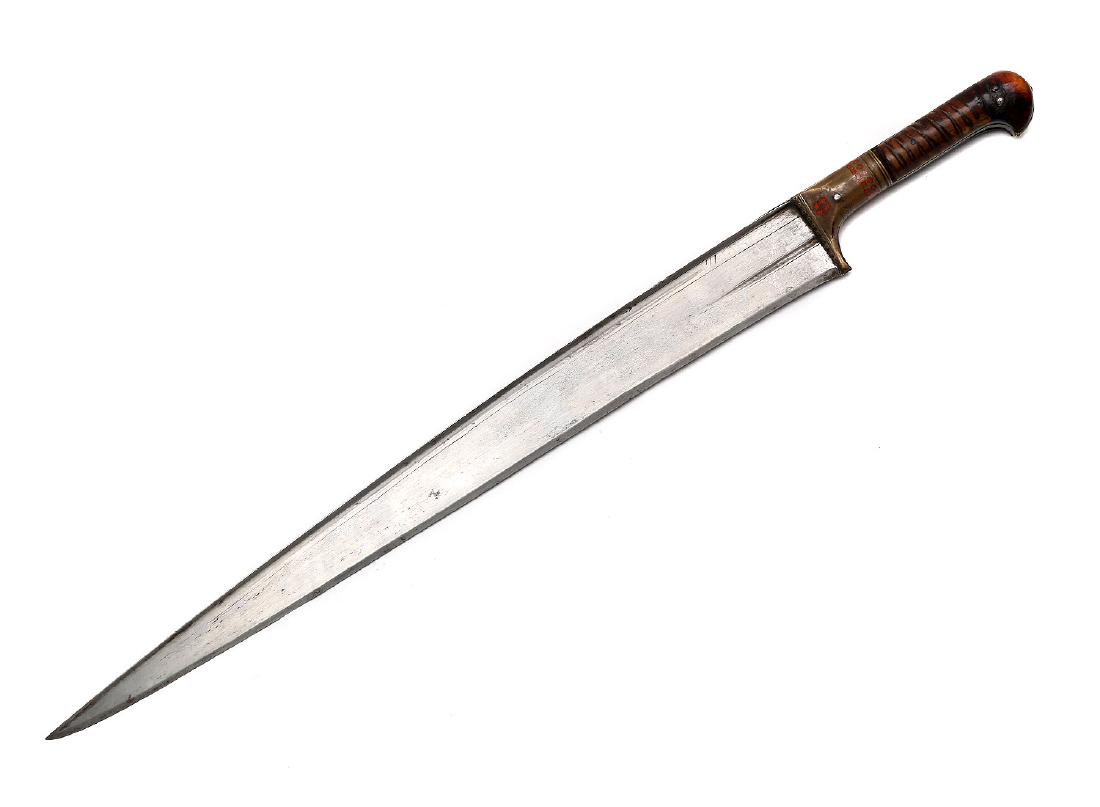 LARGE AFGHAN KHYBER KNIFE: Late 19th century large Afghan Khyber knife (salavari yatagan) with long sharp blade, brass mounts and curved horn grip.