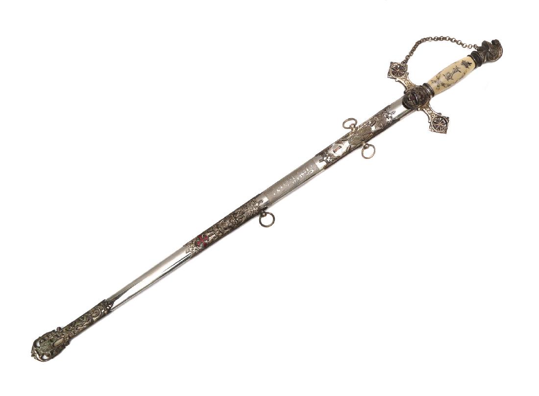 ANTIQUE MASONIC KNIGHTS TEMPLAR SWORD: Ceremonial Masonic sword with celluloid grip, enameled crossguard and scabbard, beautifully etched and gilt blade. ca. 1920. Dimensions: L: 34 1/2 in., (88 cm.)
