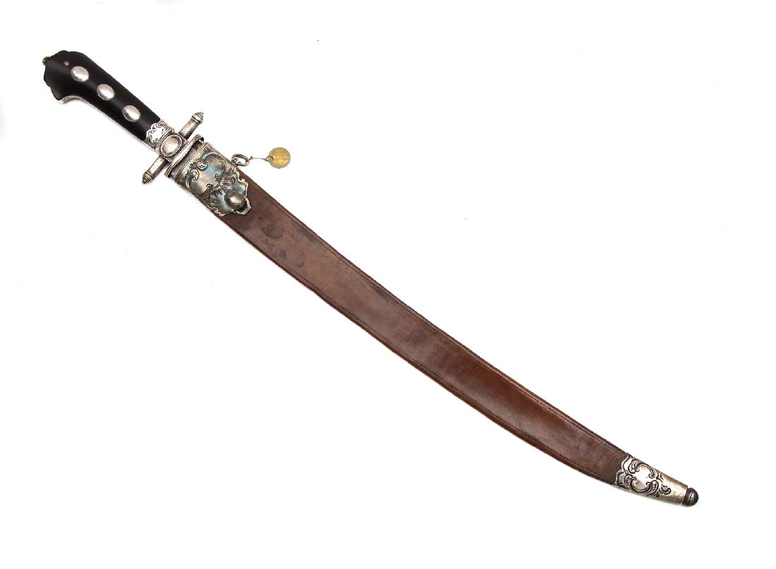 FRENCH SILVER MOUNTED HUNTING DAGGER, 19TH C.: Of characteristic form with slightly curved blade with single fuller on each side in original leather scabbard. Horn hilt with three silver rivets. Silver cross guard and repousse scabbard mounts. Sec
