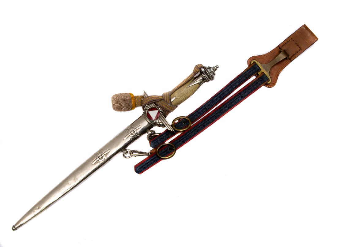 A RARE AUSTRIAN AIR FORCE PILOT"S DAGGER, M1935: Celluloid grip, pommel shaped as a crown of the Emperor Rudolf II, 1576-1612, enamel insignia on the cross guard, all metal parts are nickel plated, blade is stamped on ricasso by Vienna maker "ZEITLE