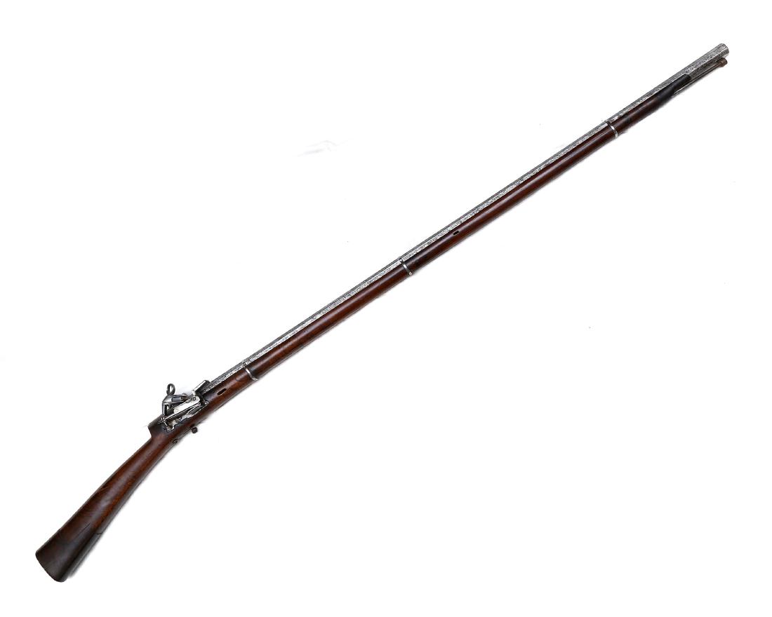 CAUCASIAN ISLAMIC RUSSIAN FLINTLOCK MUSKET: Rare flintlock musket with octagonal Damascus steel barrel, stamped with gilded maker's mark on top, iron barrel bands, steel lock with gilded maker's mark, in full working condition, wooden stock and