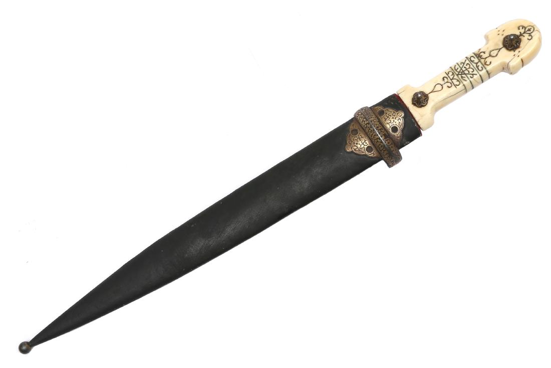 CAUCASIAN KUBACHI GILDED DAGGER, 19TH C.: Carved hilt with scroll decoration, two retaining metal buttons with gold inlay, double edged blade with one fuller on each side, wooden scabbard covered with leather and gold decorated steel mount, a