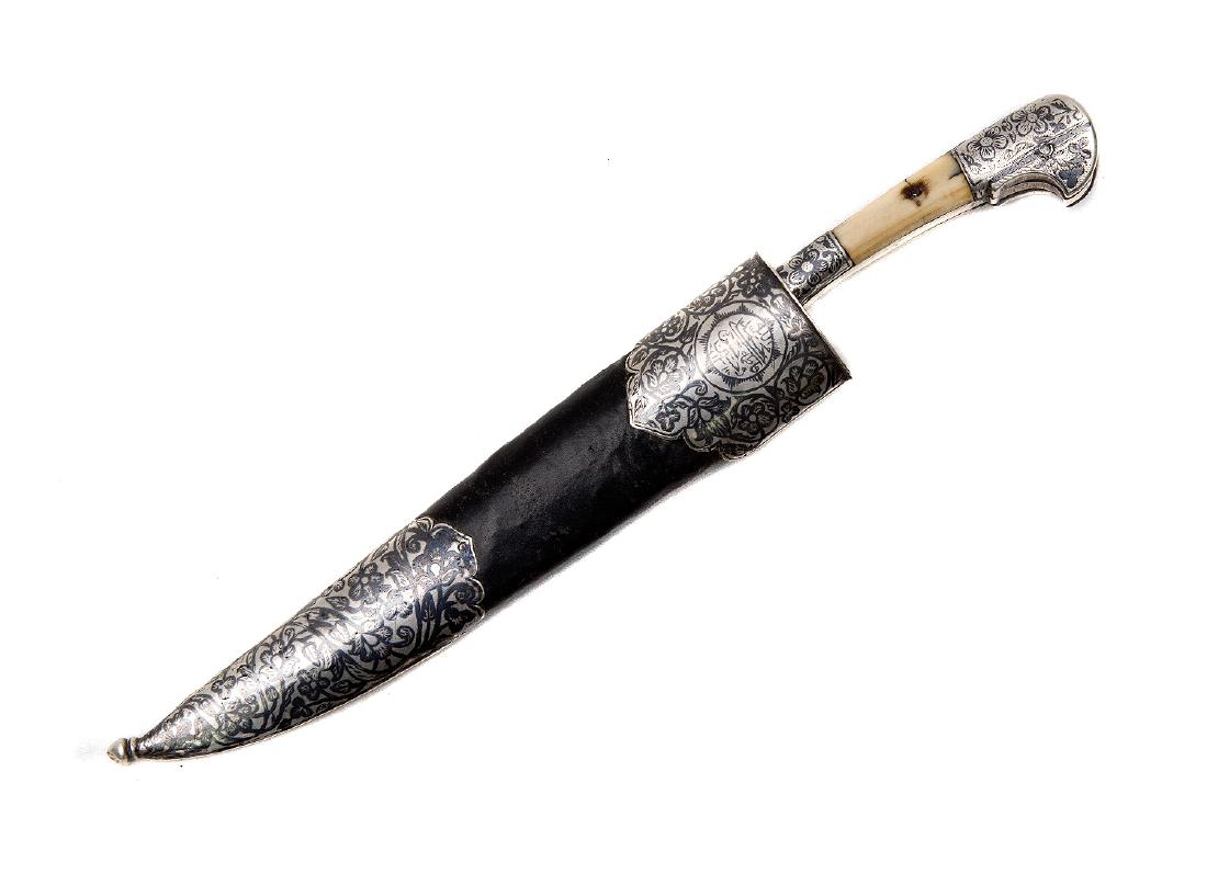 CENTRAL ASIA BUKHARA DAGGER, 19TH C.: Very rare Bukhara dagger, nielloed silver hilt with bone grip scales, single edged Damascus steel blade, wooden scabbard covered with original black leather with silver mounts decorated with niello an