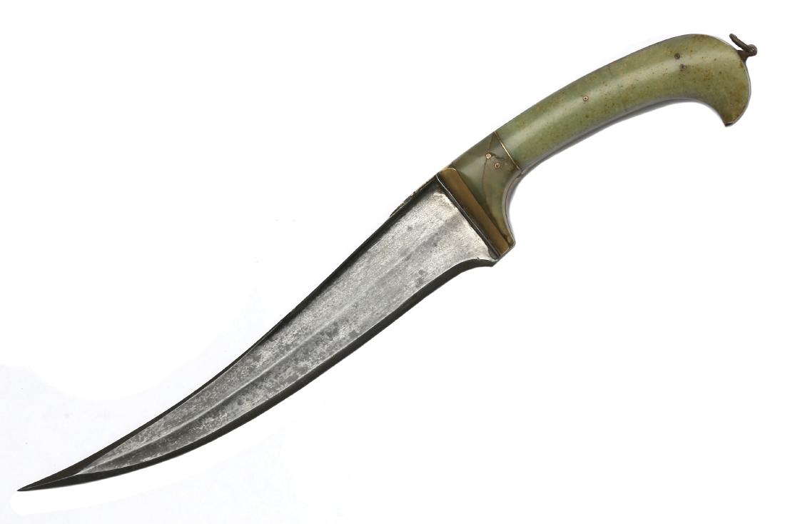 PESH KABZ WITH JADE GRIP, 19TH C.: Jade grip scales with brass hilt rib, wootz re-curved blade with t-spine and two wide fullers on each side and thick armor piercing tip. Dimensions: L: 10 5/8 in. (27 cm.)