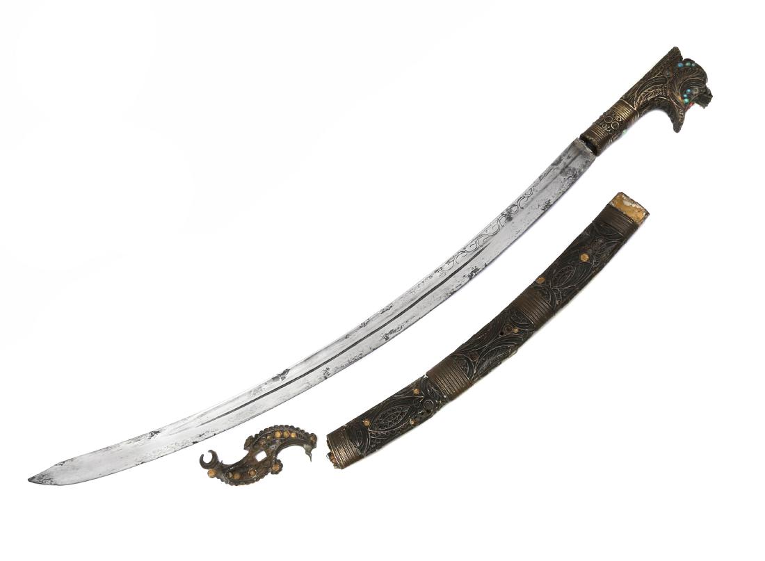 ISLAMIC NIMCHA SWORD, 19TH C.: Hilt is decorated with turquoise and other semi precious stones, hilt is coming of the tang, half of the scabbard is missing. Dimensions: L: 35 in., (89 cm.)