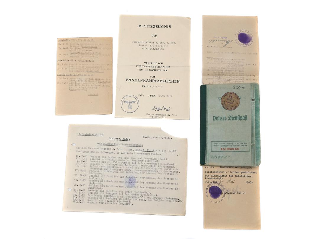 POLIZEI-DIENSTPAS AND ANTI-PARTIZAN BADGE DOC.: WW2 original Polizei-Dienstpaß. Service book of policeman, 3rd battalion, 4th regiment. Combat operations against partisans in Poland and Ukraine. On September,18 1944 the owner was awarded with anti