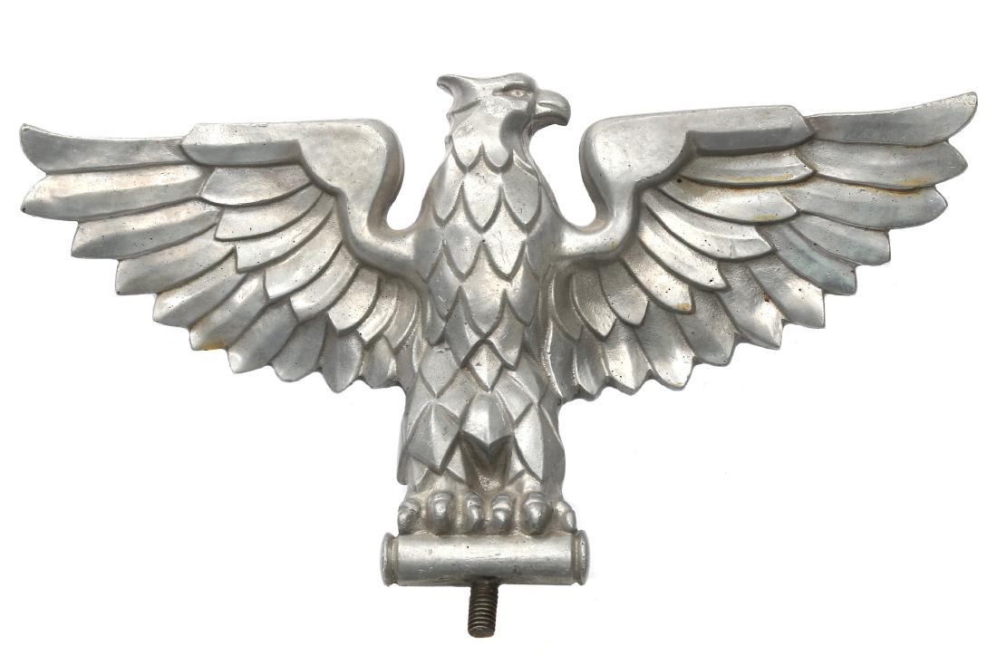 NAZI GERMAN TOPPER EAGLE WWII: Cast in solid aluminum national eagle “Hoheitszeichen” the reverse of the eagle is marked "GES. GESCH Nr. 533", threaded bolt at the bottom. Dimensions: 10 1/2 x 6 1/2 in., (27 x 16.5 cm.)