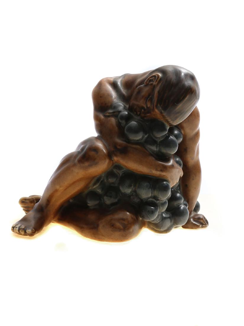 KAI NIELSEN STONEWARE GRAPE HARVESTING B&G, 1919: A hand painted stoneware figure by Kai Nielsen Bing & Grondahl Denmark Art Deco from the series '"Grape Harvesting", B&G, 1919 Dimensions: H: 6 in., (15 cm.)