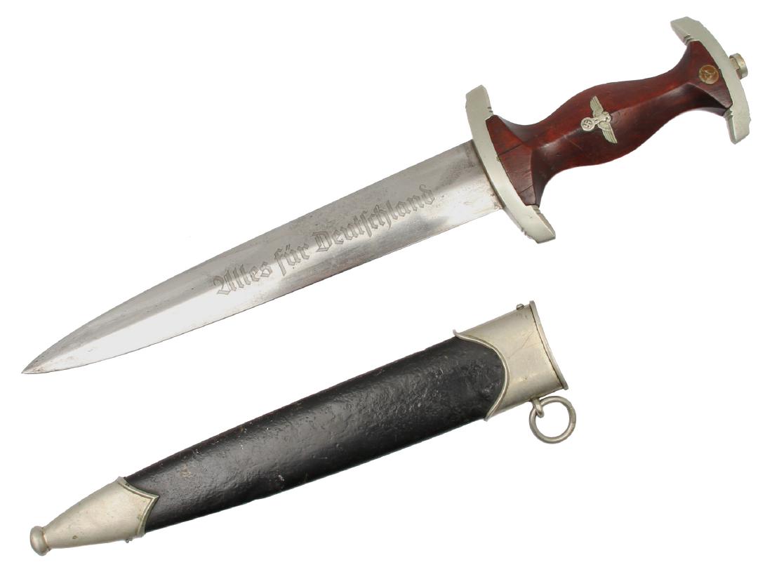 GERMANY NSKK MOTOR GROUP DAGGER BY TIGER: An NSKK German dagger made by Tiger, Solingen. This is an early NSKK dagger with dark wood grip and nickel-silver crossguards. The crossguard features the NSKK Motor Group stamp 'Ne', for 'Hessen.' Th