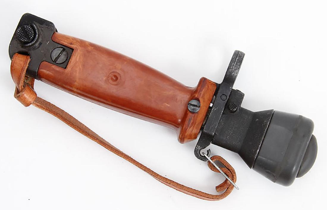 POLISH COLD WAR ERA AK TRAINING BAYONET: A rare Soviet Kalashnikov bayonet, switch false blade with rubber tip is released by a push of a button. When a successful impact has been made the blade retracts back and locks into the handle. This 