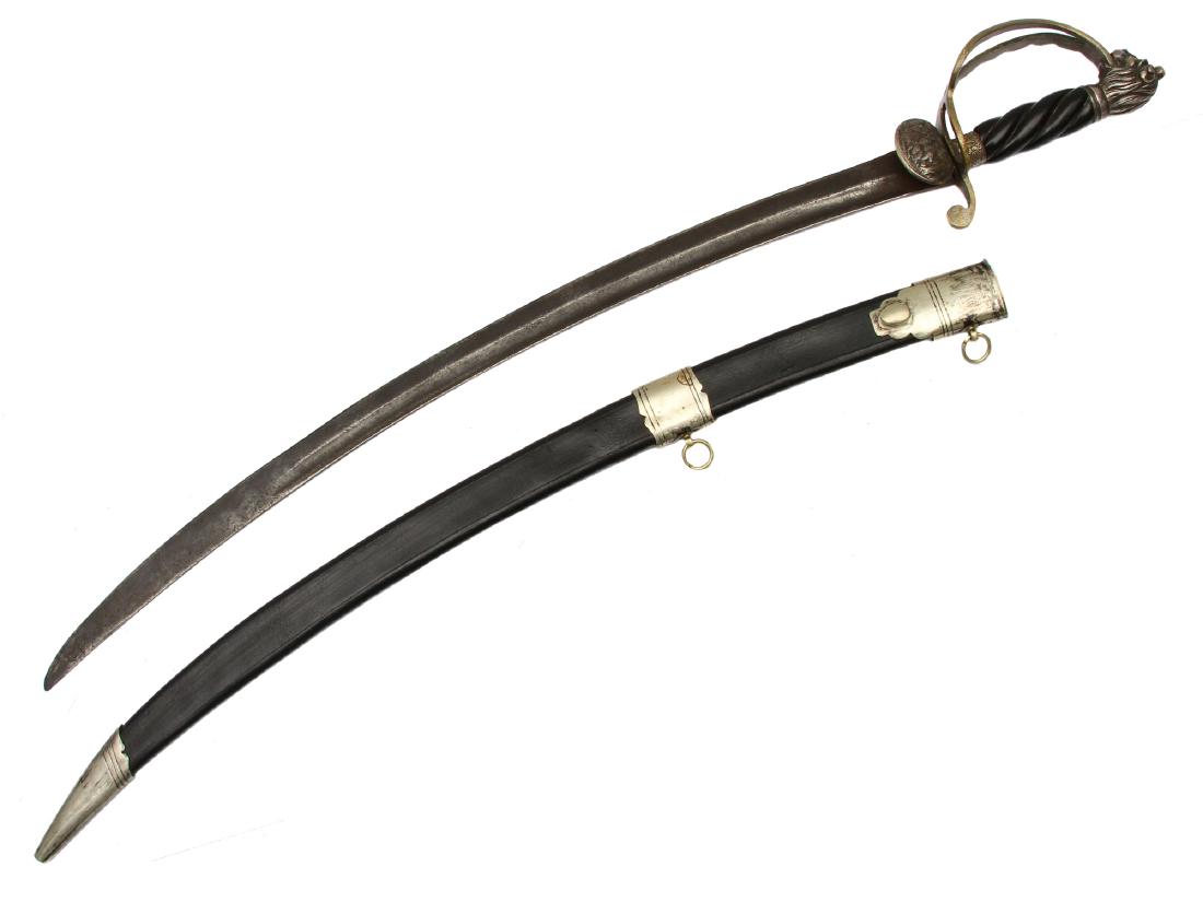 COMPOSITION GERMAN HUNTING DAGGER SWORD: Steel hilt with lion-shaped pommel and finely engraved ferrule, bakelite handle, clam shell guard depicting deer, curved blade with wide fuller, black leather scabbard with mount. Dimensions: L: 34 1/